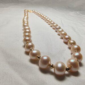 Gorgeous Pearl necklace with 14K gold beads.
